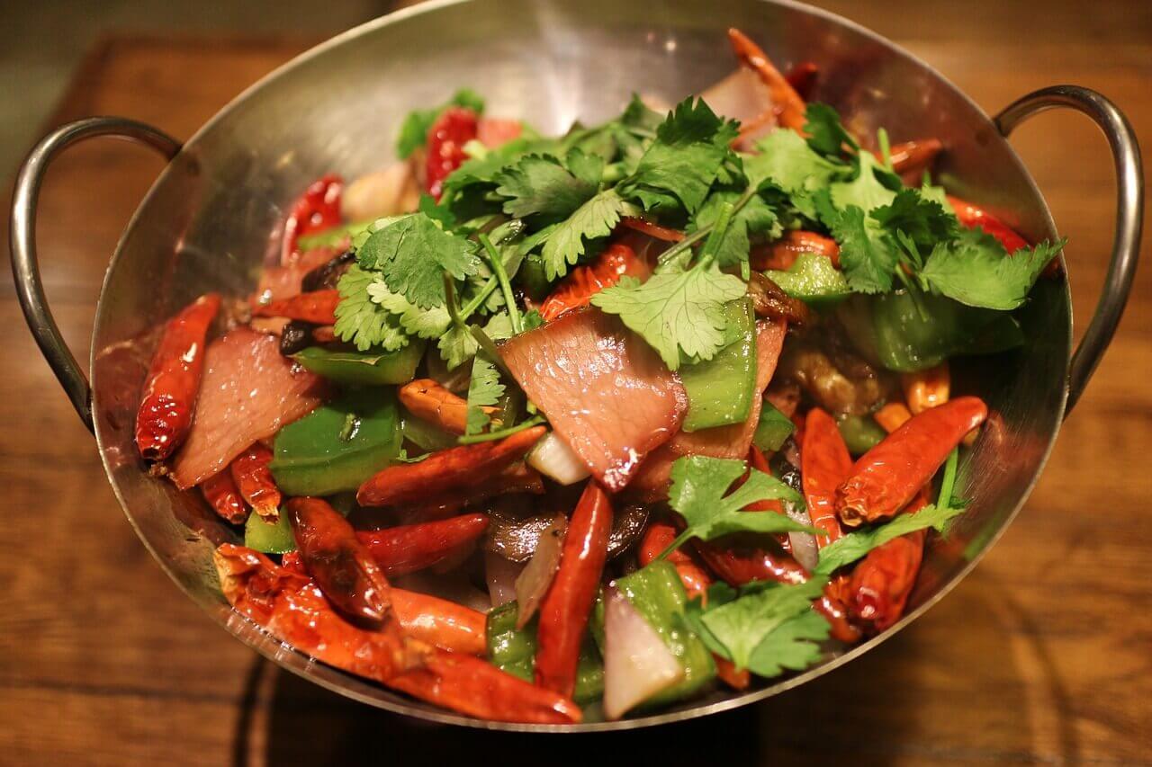 So there are some green leafy things, and these pepper-type things and then some meat-looking stuff that’s cooked in a thing with heat under it — am I getting this right?
